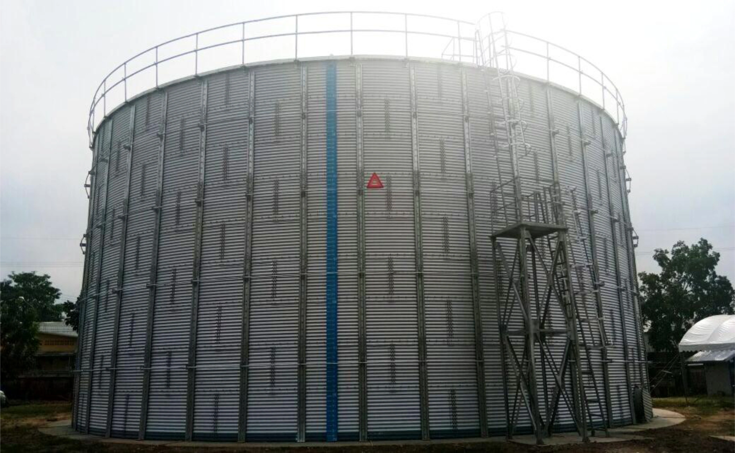 A large ZINCALUME TANKS with a blue vertical stripe.